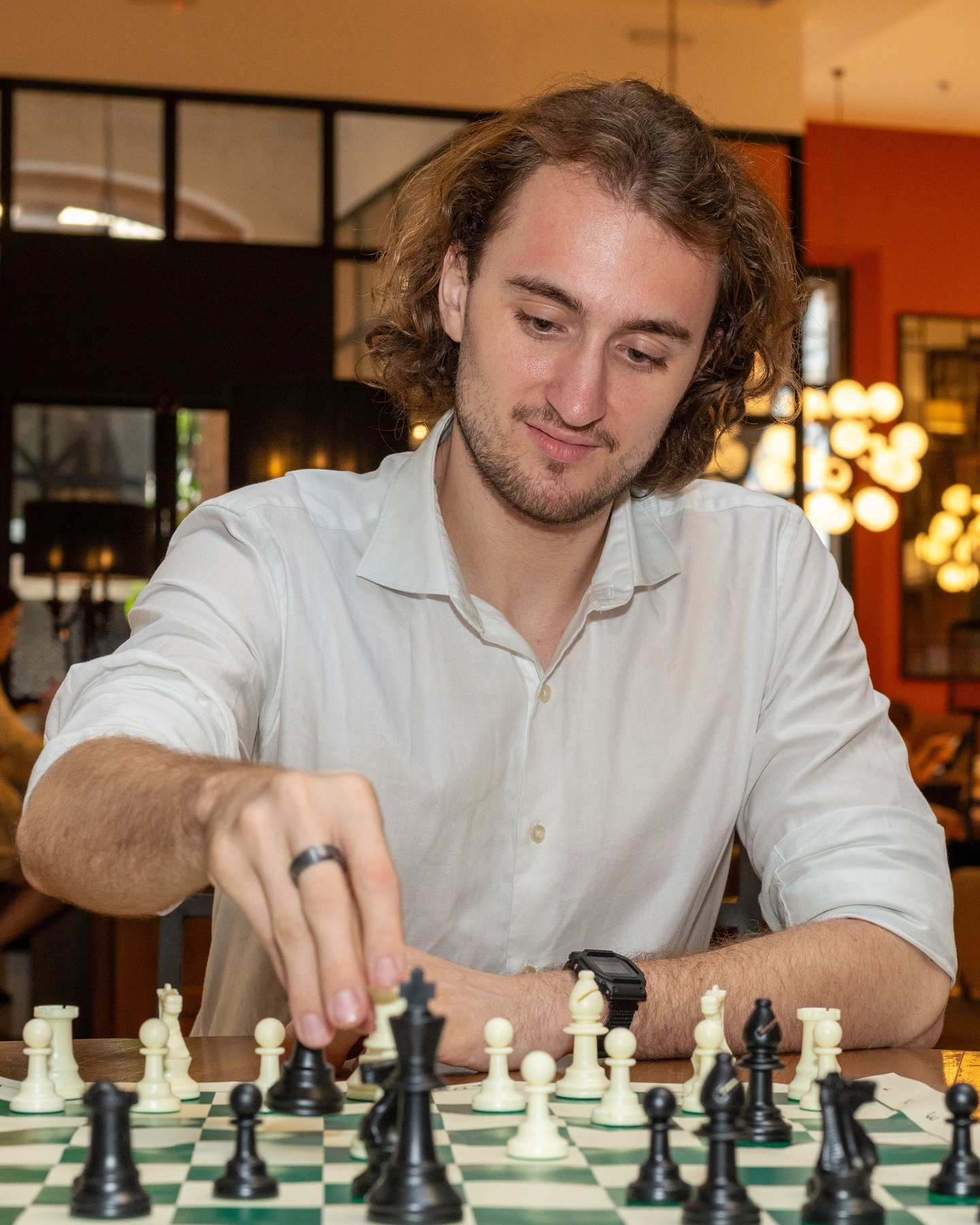 After: Playing chess at a hotel bar. People actually ask about this one.