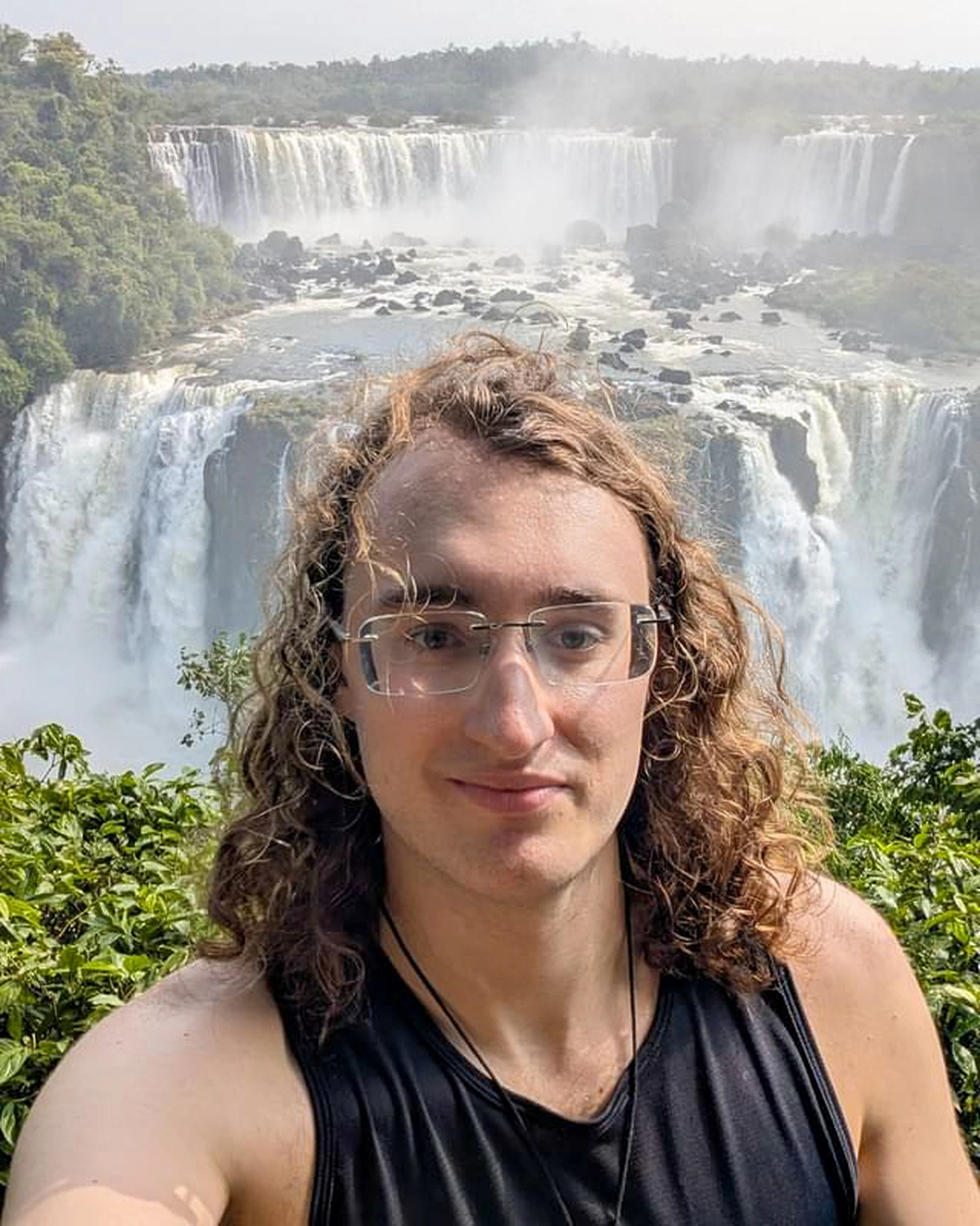 Before: Selfie at Iguazú Falls. Cool trip but it's not doing anything for his profile.