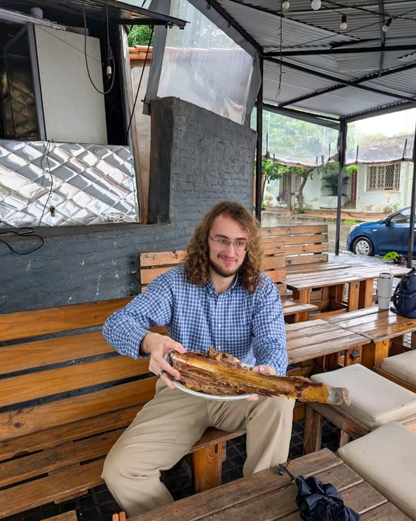 Before: Holding a giant rib at a restaurant. Fun photo, wrong context.