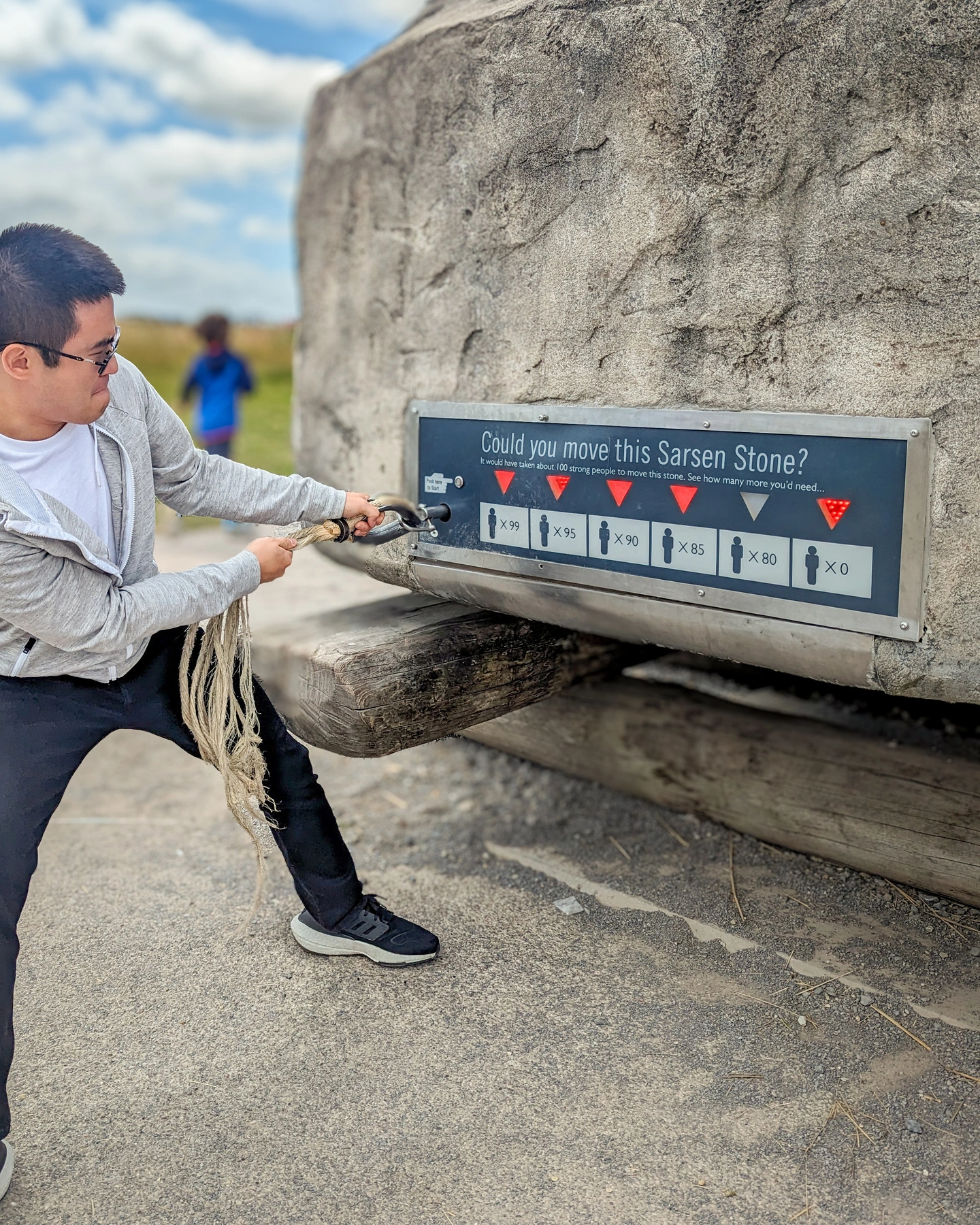 Before: Pulling a rope at Stonehenge. Fun but he's the smallest thing in the frame.